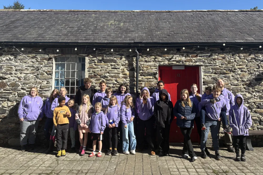 If you're reading this, I don't mean to sound awful but I tried resizing this image on a Windows PC instead of a Mac for the first time in years and it was a nightmare. I grew up on Windows and I'm very nerdy but trying to resize this was a NIGHTMARE. Maybe I'm rusty but I think it's more that Mac is WAY BETTER for stuff like this. Anyway, this is a group of kids who have been through hell standing in a group and smiling like champs because they're awesome. I'm in the back smiling like a loon but forget that. Every kid in this in swimming against the tide and they're winning. They're great.